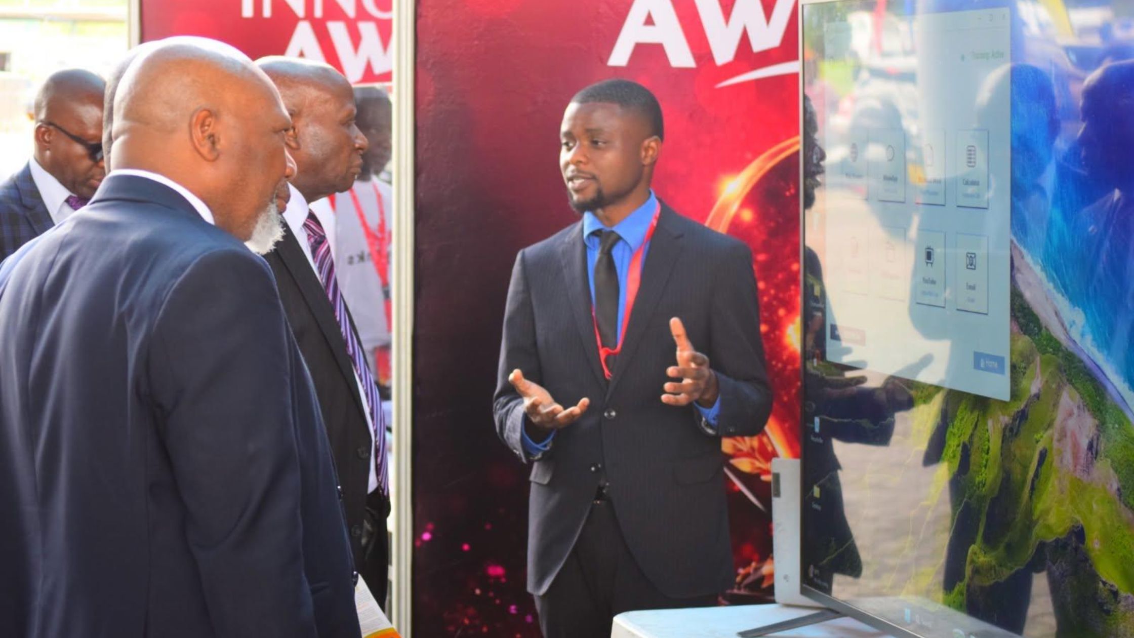 Chimwemwe presents his Eye-Control Assistive Technology innovation to visiting dignitaries during the ICT Awards.